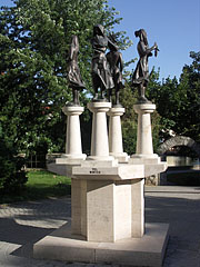 "Four Seasons", a group of bronze statues on stone pedestal in the park - Tapolca, Ungaria