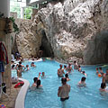 The indoor bath hall of the Cave Bath in Miskolctapolca, including the thermal water adventure pool and the entrances of the cave pools - Miskolc, Madžarska