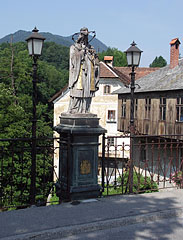 Statue of St. John of Nepomuk on the 13th-century Capuchin Bridge over the Selška Sora River - Škofja Loka, Slovenya