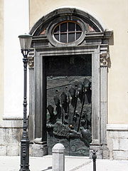 One of the bronze doors of the St. Nicholas's Cathedral, namely the "Ljubljana Door" with relief portraits of some 20th-century bishops of the city, as well as the figure of Jesus Christ (work of Mirsad Begić) - Ljubljana, Slovenia