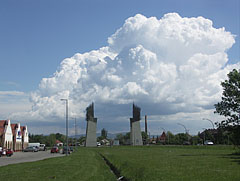 The Tokaj-Hegyalja World Heritage Gate on the main road, with gathering cumulus clouds above it - Szerencs, Unkari
