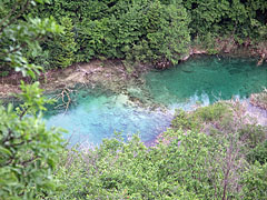 The blue and clear water of the Korana River in the bottom of the valley - Plitvice Lakes National Park, Хърватия