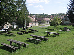 Picnic area, wooden tables and benches near the parking lot ath the foot of the castle hill - Nógrád, Ungari