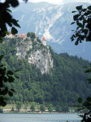 The castle of Bled on the top of a cliff, viewed from the lake - Bled, Slovenya