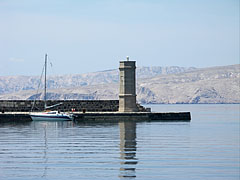 Another lighthouse on the cost at the harbor, with an island in the background - Senj, Croația