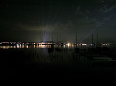 View to Balatonfüred at night, and berthed sailboats in the foreground of the picture - Tihany, Ungaria