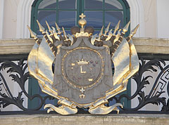 The gold-plated crest of the Esterházy family on the balcony of the palace - Fertőd, Hungria