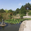 Fishpond in the Japanese Garden, and the statue of a seated female figure in the middle of it - Budimpešta, Madžarska