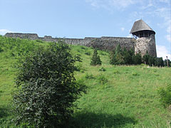 The ruins of the irregular shaped mediaeval Castle of Nógrád on the green castle hill - Nógrád, Ungari