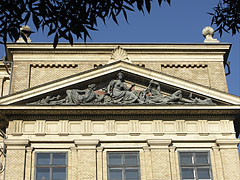 The pediment of the main building of the Eötvös Loránd University (ELTE) Faculty of Humanities (BTK) with a triangular tympanum, including the "Mineralogy" sculpture group - Budapest, Ungarn