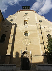 The baroque facade of the yellow St. James' Church - Kőszeg, Hungary