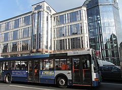 The modern all-glass East-West Business Center office building with a blue city bus (a Hungarian-made "Ikarus" model) in front of it - Budapešť, Maďarsko