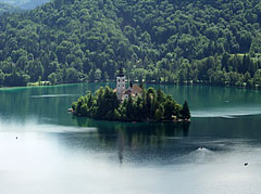 Tiny island with a church in the middle of the beautiful deep green Bled Lake, viewed from the castle - Bled, Slovenya