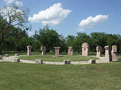 The Jubilee Memorial at the edge of the park, for the 50th anniversary of declaring Ajka as a town, the stone columns of it symbolize the 8 settlements in the Ajka subregion - Ajka, Ungaria