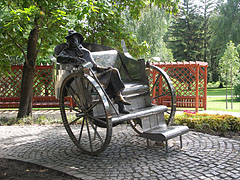 Metal sculpture of Gyula Krúdy Hungarian writer, sitting on a carriage - Siófok, Ungheria