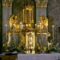 The gold-plated main altar with angel sculptures in the Roman Catholic St. Michael's Church - Dunakeszi, Hungary